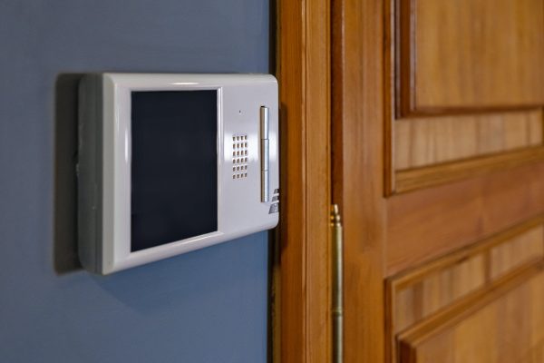 Video intercom display near the entrance door at home close up
